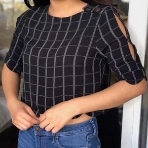 A black shirt with white stripes